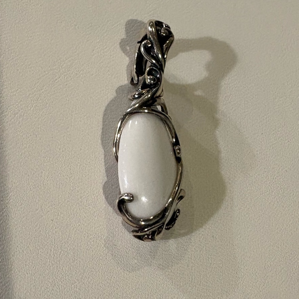 White Oblong Stone Wrapped in Silver Tone Enhancer